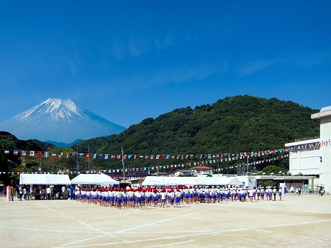 Okayama, Japan - September 18, 2010: Schoolyard at an elementary school in Japan. Sports day at elementary school is usually held in October. Mt. Fuji is in the background. (composite photograph) 