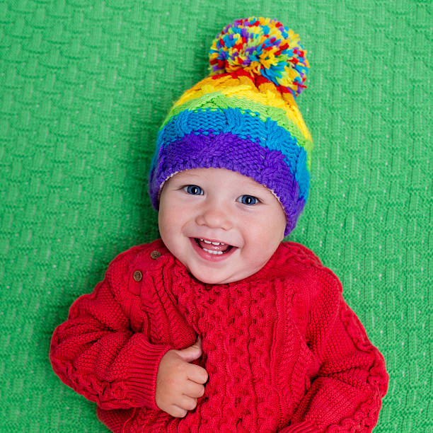 istock Little baby in warm wool knitted hat 578589586