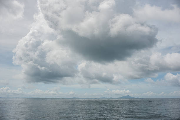 istock The sun higher than rain cloud over the sea. Thailand. 578591034