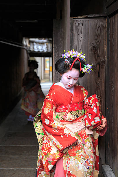 istock Maiko girls standing in narrow path 578591764