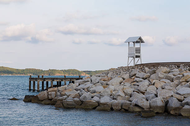 istock White lifeguard over rock on the seacoast 578593618
