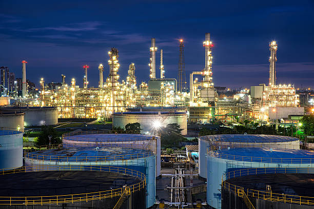 istock Oil refinery or petroleum refinery and storage tanks in night. 578594780