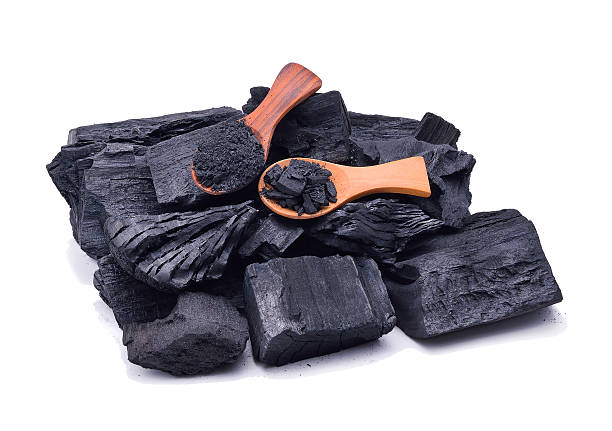 istock Natural wood charcoal isolated on white background 578597828