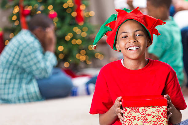istock Handsome boy holds Christmas gift 578599242