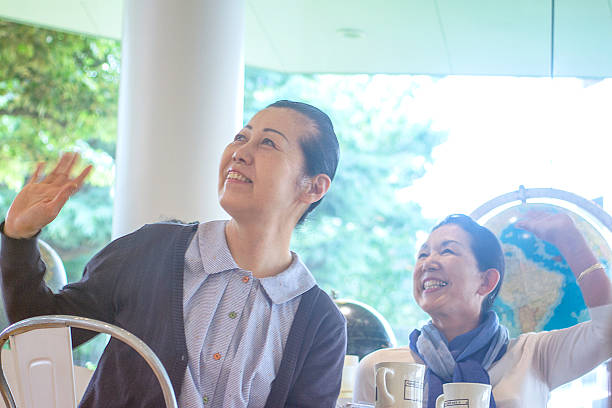istock Two adult women shaking their hand 578599792