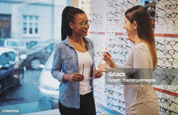 African American Woman In An Optometrist Stock Photo - Download Image Now - Optometrist, Store, Eyeglasses