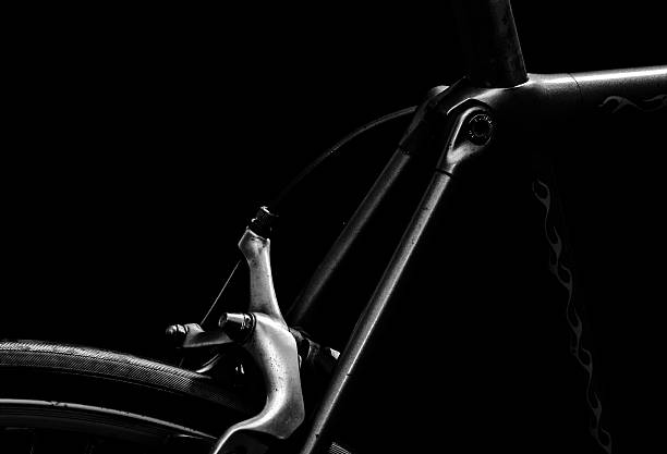istock low key black and white silhouette of bicycle black background 578600196