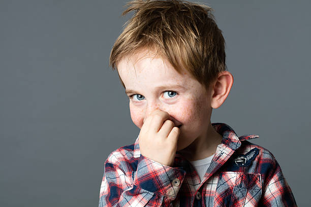 istock cute little boy picking his nose to act mischievous 578791324