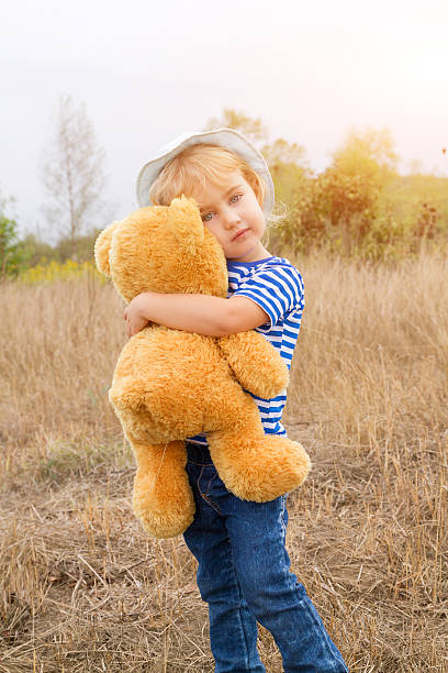 istock Cute little girl hugging a big Teddy bear 578792020