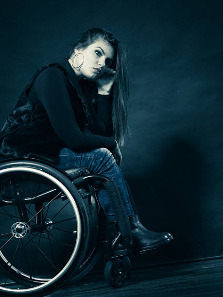 istock Sad woman sitting on wheelchair 578793734