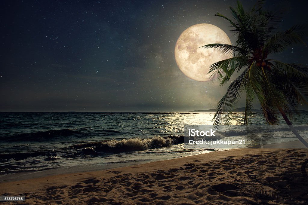 beach and full moon Beautiful fantasy tropical beach with Milky Way star in night skies, full moon - Retro style artwork with vintage color tone (Elements of this moon image furnished by NASA) Night Stock Photo