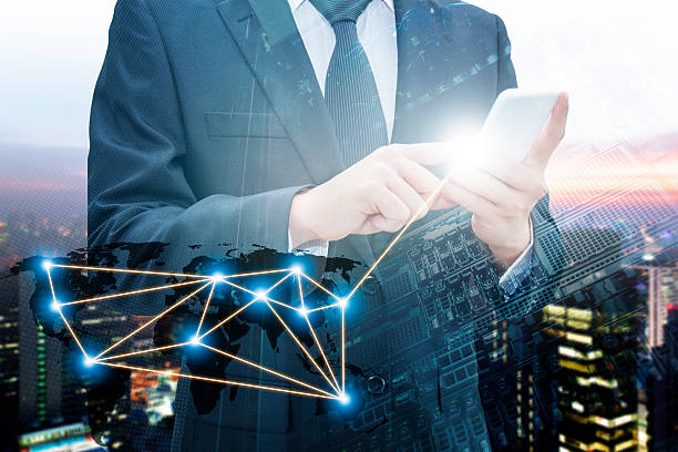 istock Double exposure of businessman using smart phone network connection 578797078