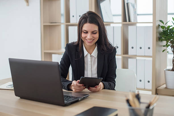 istock Business woman with notebook in office, workplace 578803562