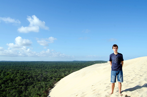 Young adult at the famous and beautiful Dune du Pyla, in France.