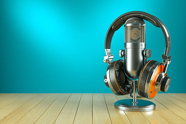 Professional studio microphone and headphones on wooden table Professional studio microphone and headphones on wooden table 3d render radio dj stock pictures, royalty-free photos & images