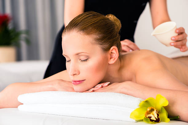 istock Woman having wellness massage in spa 578803932