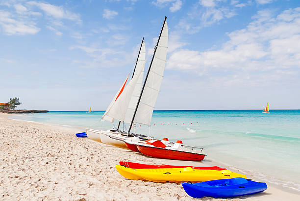istock Colorful catamarans on sandy Varadero beach. Bright sunny day, Cuba. 578805202