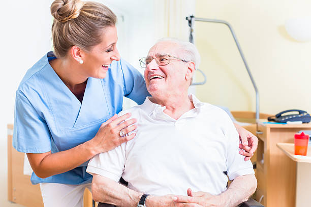 istock Senior man and old age nurse in nursing home 578805662