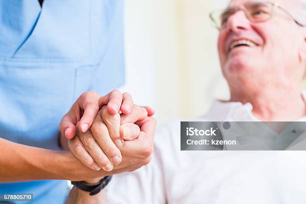 Senior Man And Old Age Nurse In Nursing Home Stock Photo - Download Image Now - Senior Men, Happiness, Home Caregiver