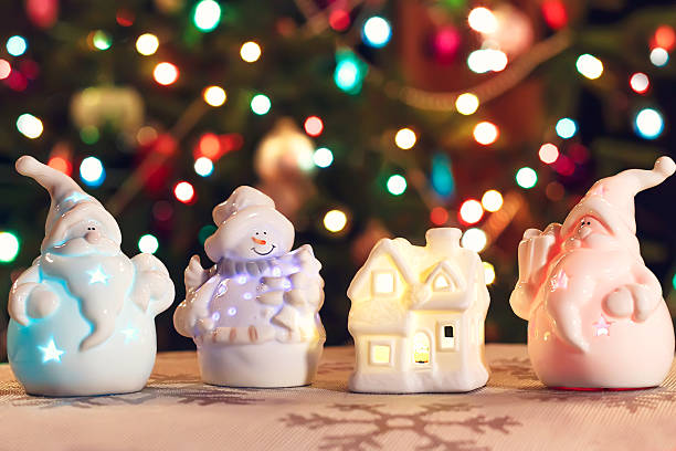 illuminated snowman, christmas house and jack frost (santa claus) - luminant imagens e fotografias de stock