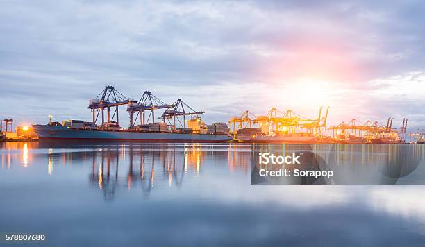 Containers Loading Shipping By Crane Stock Photo - Download Image Now - Blue, Business, Business Finance and Industry