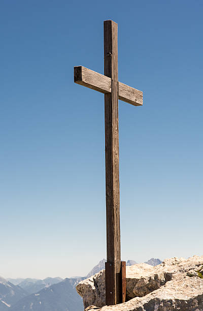 istock Wooden summit cross in the alps 578810346
