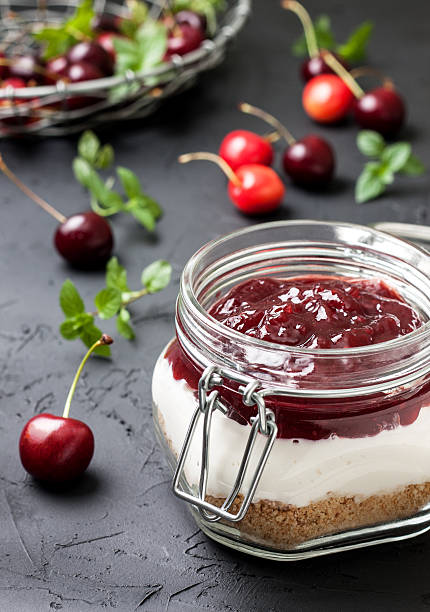 istock cheesecake in a glass jar with cherries 578810358