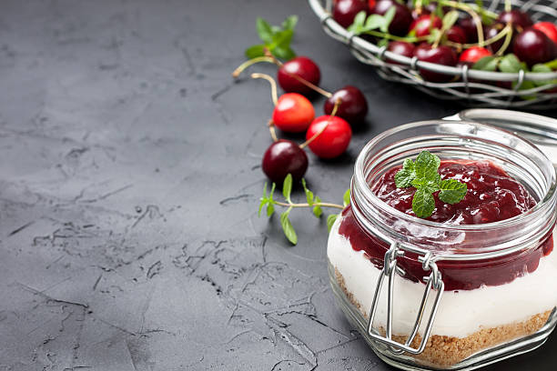 istock cheesecake in a glass jar with cherries 578810554