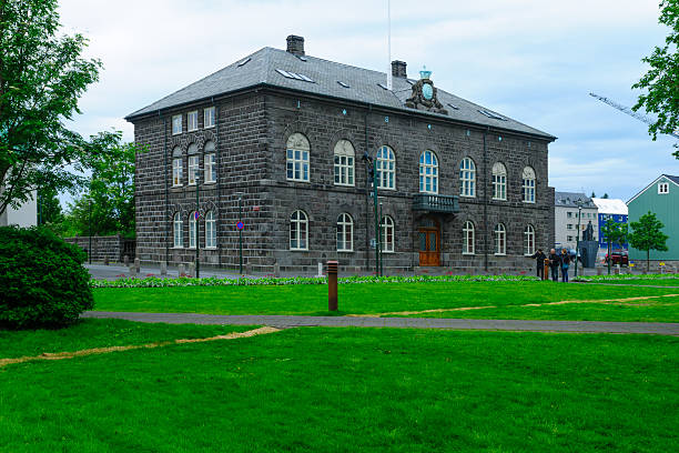 Reykjavik, Iceland - June 11, 2016: The Parliament (Althingi) House, with locals and visitors, in Reykjavik, Iceland