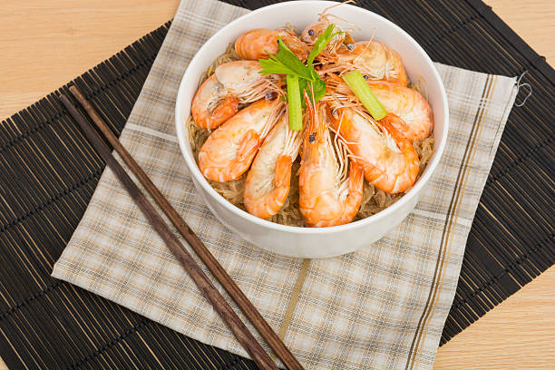 baked vermicelli with shrimp in white cup on wooden background