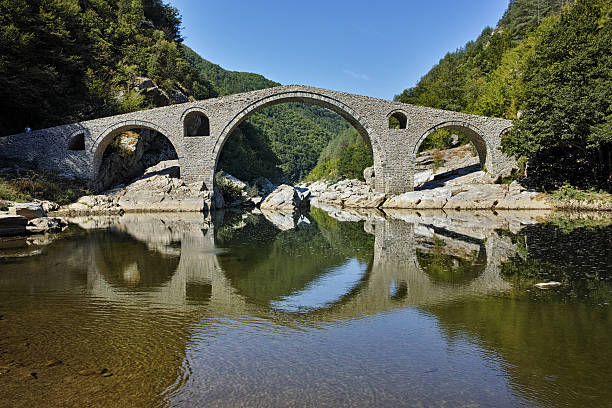 istock Amazing Reflection of The Devil's Bridge in Arda river, Bulgaria 578812218
