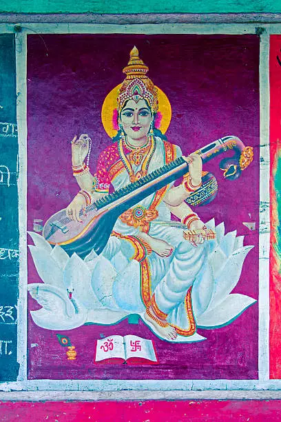Painting of sarasvati, goddess of speech and eloquence drawing on a slate, India