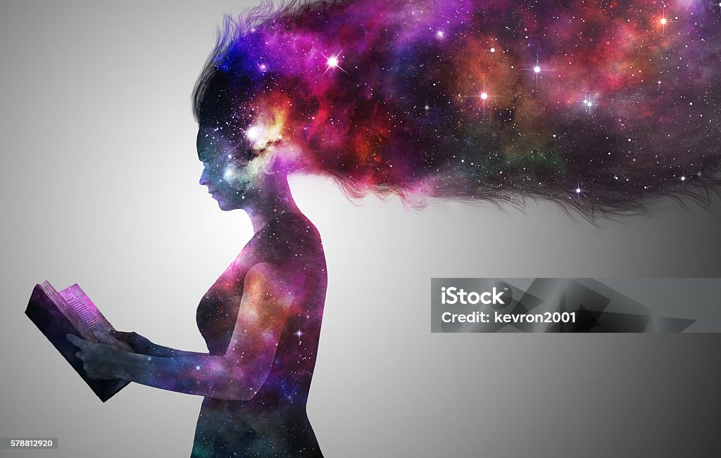 Universe woman A woman in silhoutte reading a book with the universe. Book Stock Photo