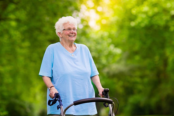 istock Beautiful senior lady with a walker 578814946