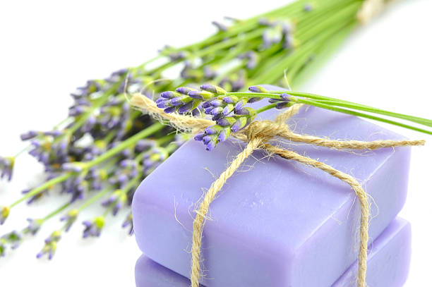 istock Handmade soap and lavender flowers on a white background 578816574
