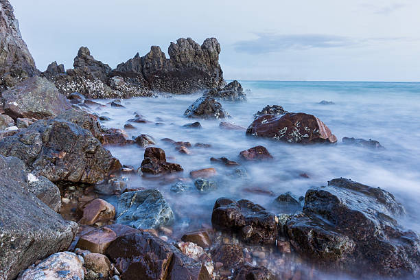 istock seascape,stone beach and sea wave.long exposure. 578818610