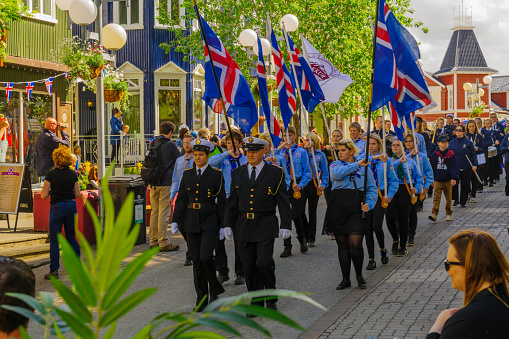 Akureyri, Iceland - June 17, 2016: Locals and visitors attend the Independence Day parade in the main street of Akureyri, Iceland