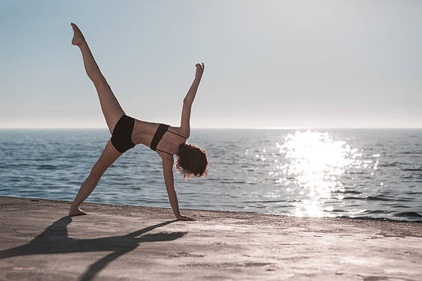 istock woman doing yoga 578821154