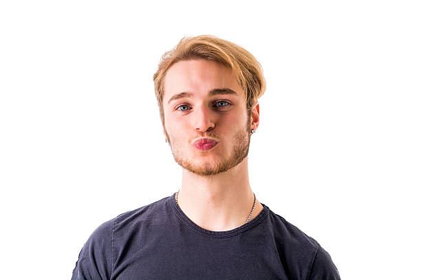 istock Handsome young man sending a kiss with his lips 578821464