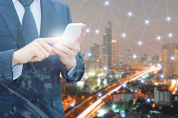 istock Double exposure of professional businessman using smart phone 578822536