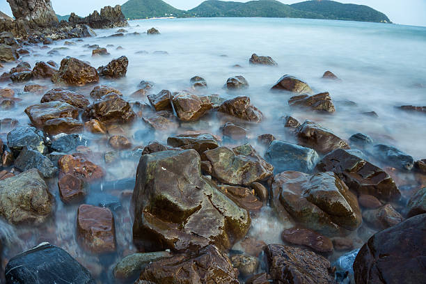 istock seascape,stone beach and sea wave.long exposure. 578823710