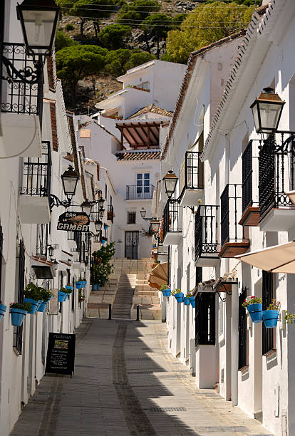 Mijas village street scene. Spain. The beautiful Mijas pueblo ( village ) Also known as the white village. Nestled in the hills above Fuengirola on the Costa del sol Andalucia Spain. This is one of the typical street scenes in the village. mijas pueblo stock pictures, royalty-free photos & images