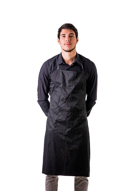istock Young chef or waiter wearing black apron isolated 578827084