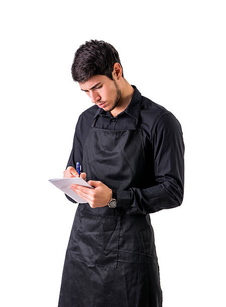 istock Young chef or waiter wearing black apron isolated 578827160