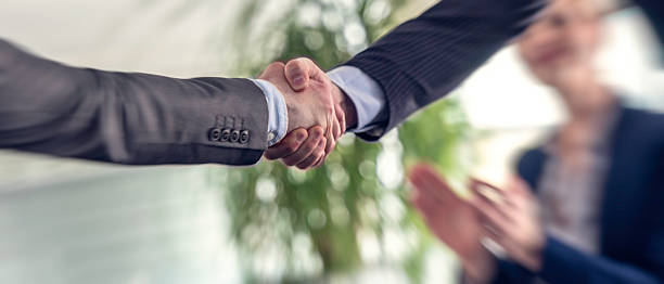 istock Businessmen come to an agreement and shake hands 578828244