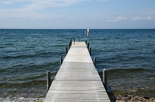 Old wooden bath pier straight into the ocean