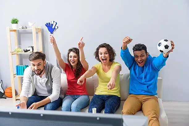 Photo of Group of multi national football fans cheering