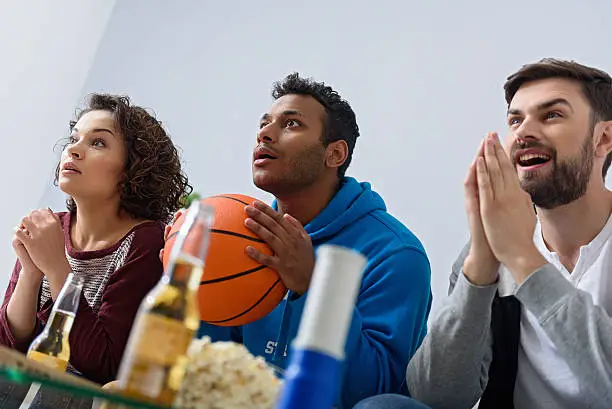 Photo of Friends watching sport on TV