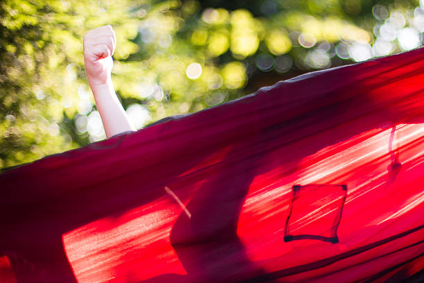 Child in a hammock, Fist, Red, Green