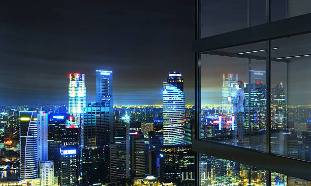 istock Businessperson on balcony at night 578833954